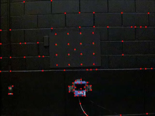 Feature tracking across frames, with matched features marked on the target and surrounding structure